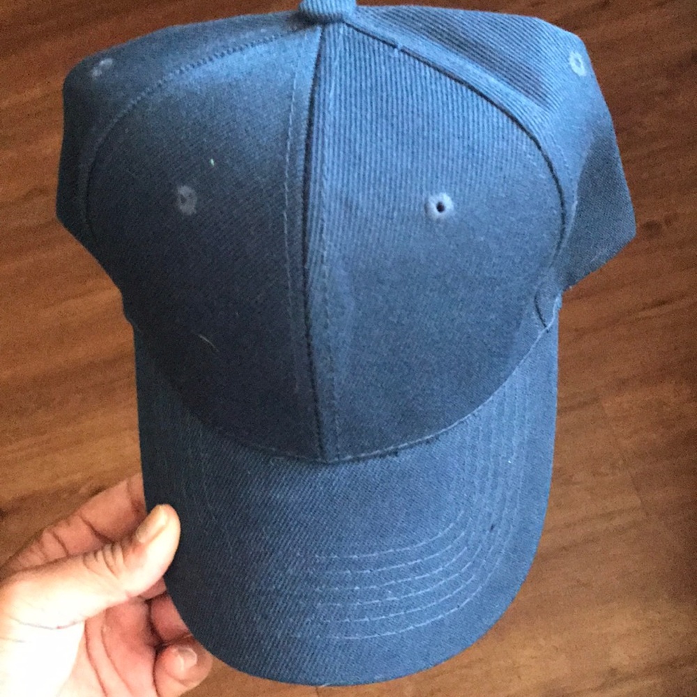 Brand new blue hat never worn, made in Bangladesh.